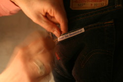Sewing in message label on jeans
